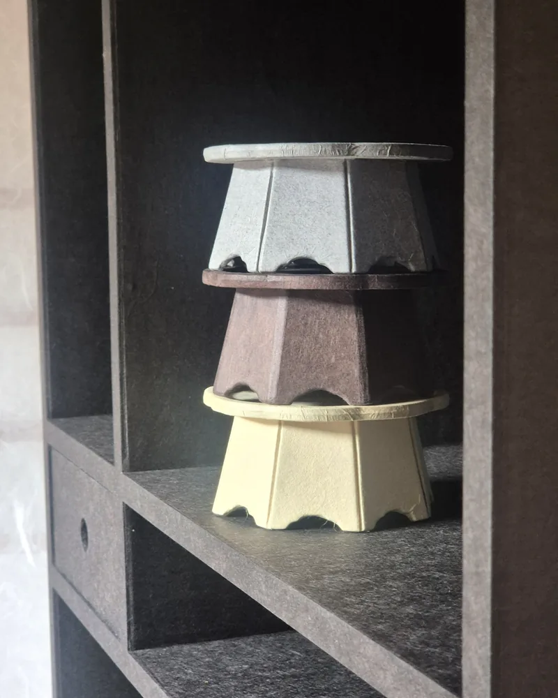 Stacked hanji objects on studio shelving